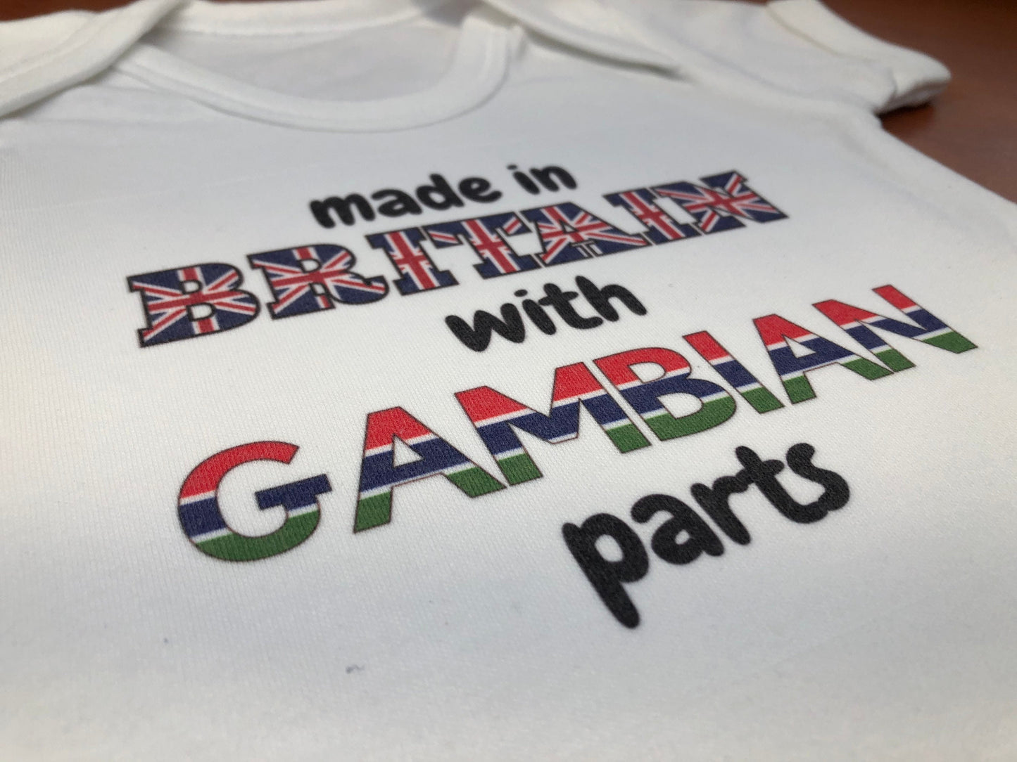 Made in Britain with Gambian parts Baby-grow / vest  ( Made to order )