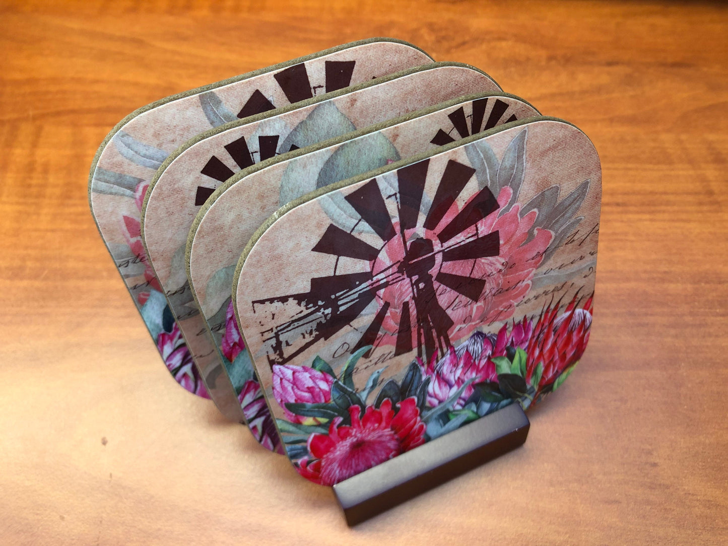 Mahogany stained display stand for 4 coasters.