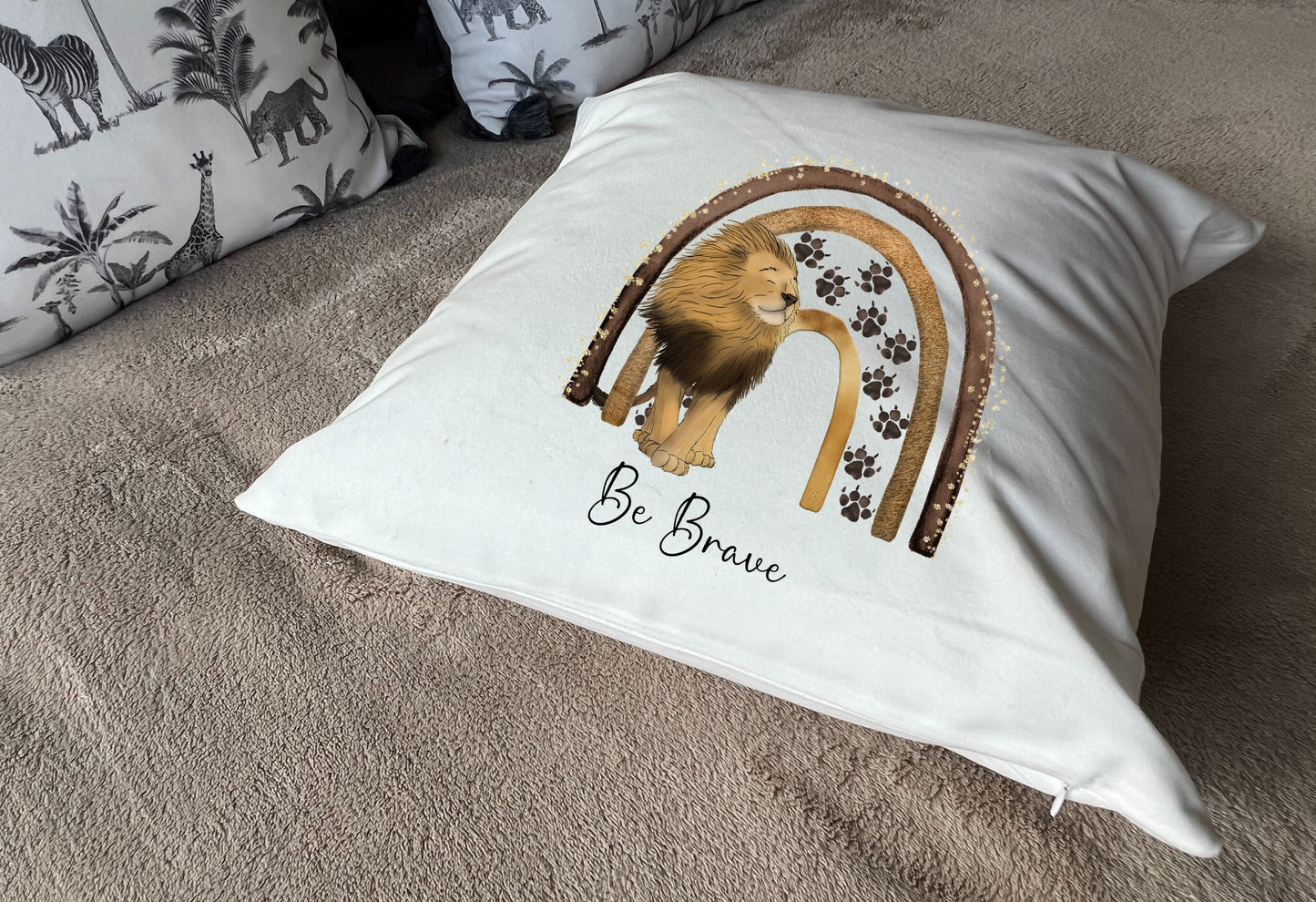 Lion 'Be Brave' plush white deluxe scatter cushion.  Available with inner (UK)