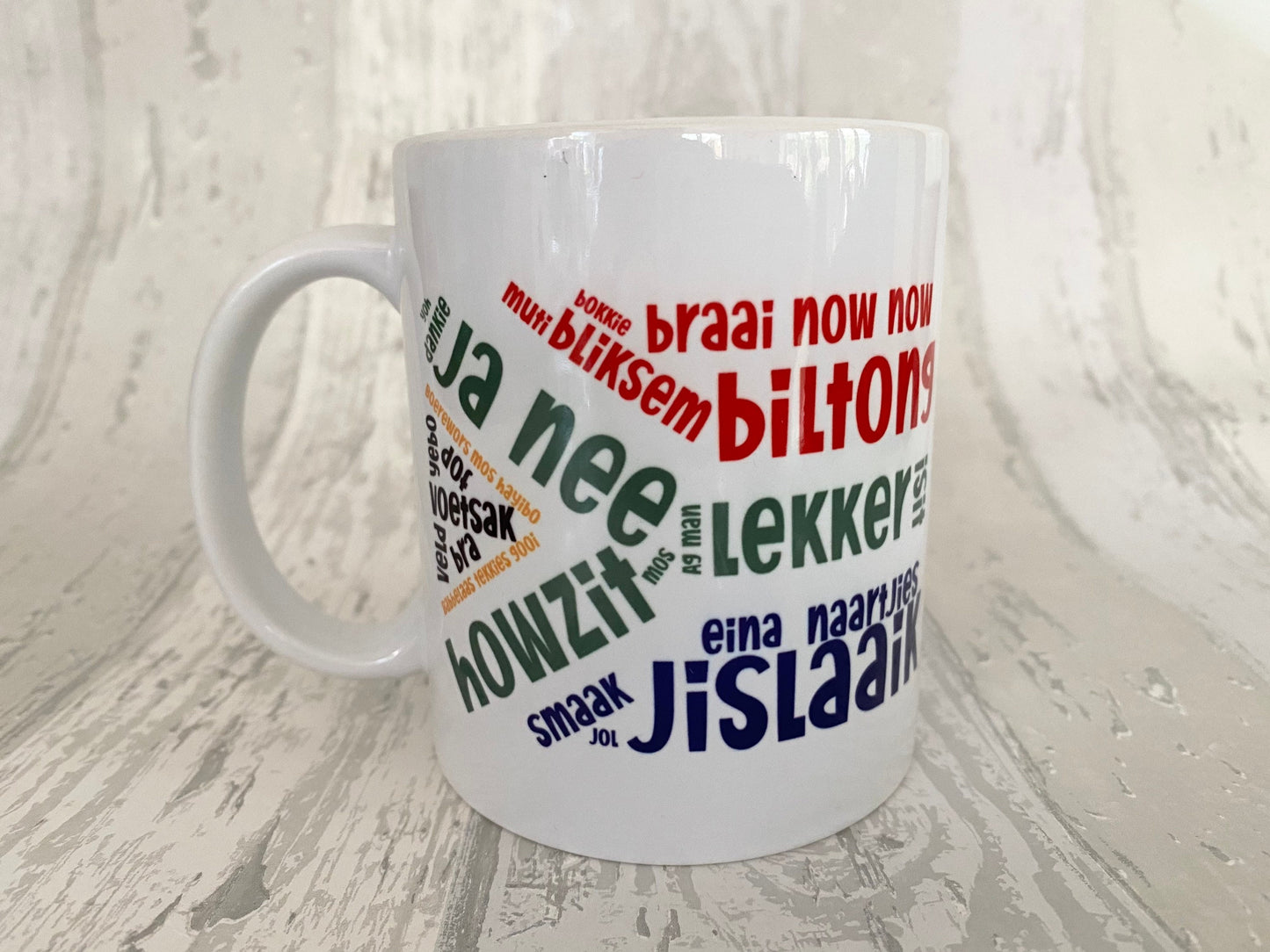 South African slang sayings in the South African flag 11oz mug. Afrikaans slang. SAFFA mug. Flag Art.