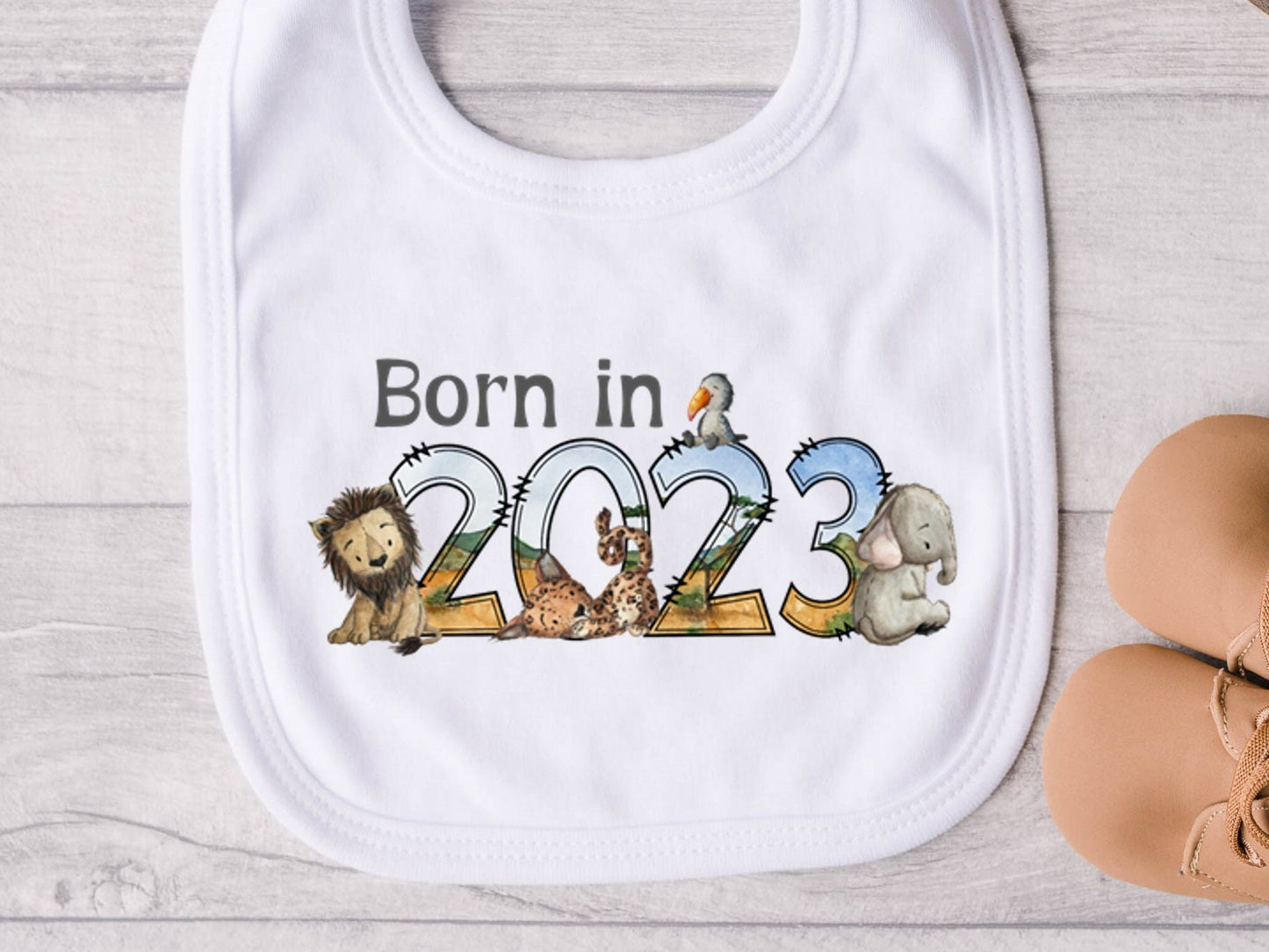 Baby Bib. Born in 2023 safari animal design. New baby gift. Pregnancy Announcement. Gender neutral baby gift. Boy or Girl baby gift.