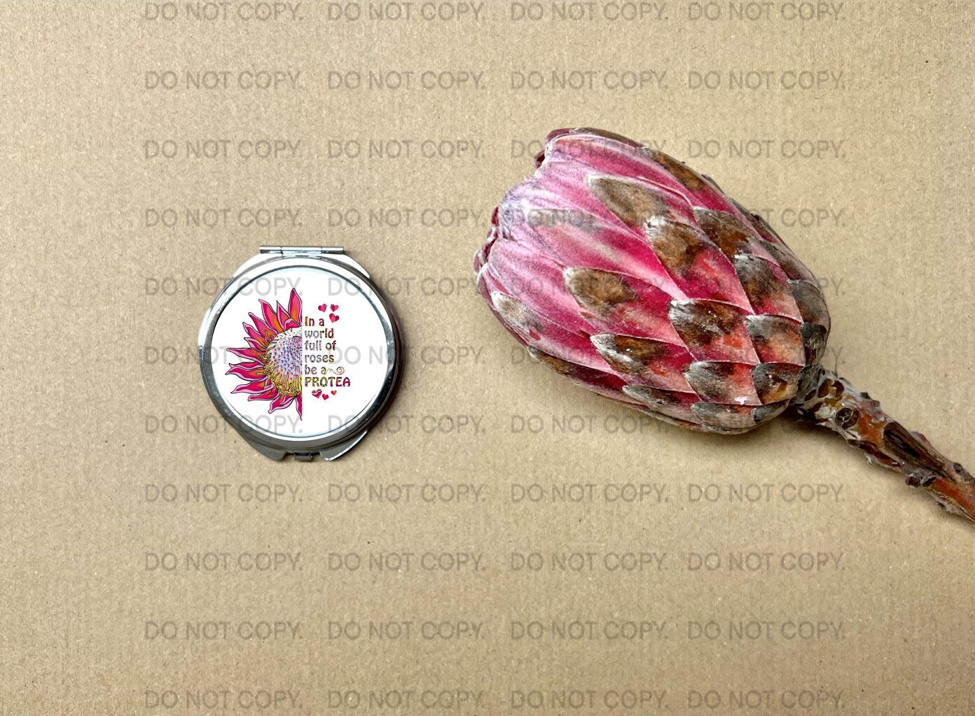 Small hand bag mirror with the motivational quote " In a world full of roses be a protea" Pink protea flower Inspirational Birthday gift